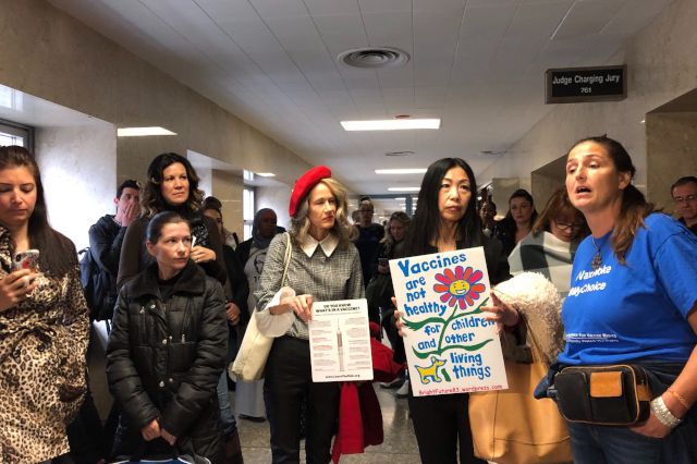 Anti-vaccination activists attend a court hearing in Brooklyn.